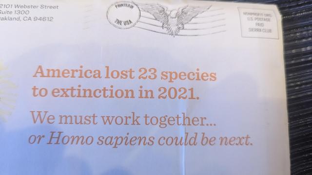 Mailing from the Sierra Club with the statement "America lost 23 species to extinction in 2021. We must work together...or Homo Sapiens could be next."