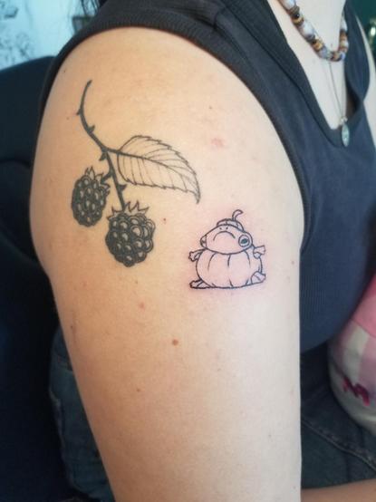 Tattoo of a frog stuck in a pumpkin