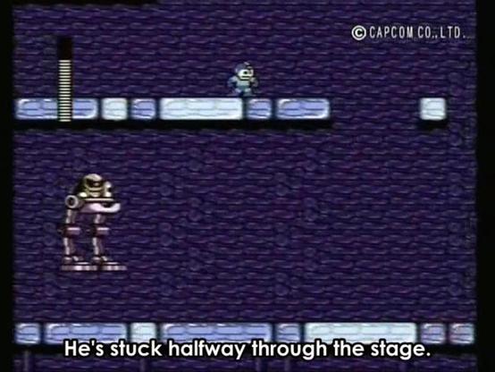 A screenshot from Game Center CX, showing gameplay of the NES game Mega Man 2. Mega Man is standing in Flash Man's stage, with an enemy visible below him. A subtitle for the narrator says, "He's stuck halfway through the stage," and text in the top-right reads "© Capcom Co. Ltd."