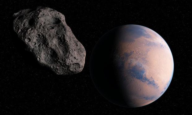 Asteroide y la Tierra en una ilustración. (Getty Images/Science Photo Libra)