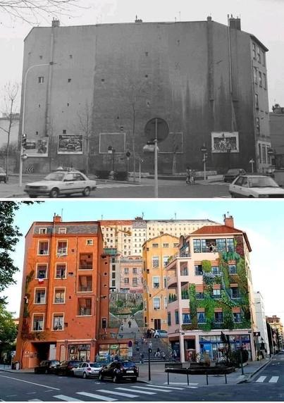 A before-and-after image showcasing the transformative mural known as the 'Wall of the Silk Weavers' in Lyon, France. The top half of the image shows the plain, blank wall of a building in a black-and-white photo from before the mural's creation. In contrast, the bottom half reveals the same wall after being painted with an intricate, lifelike mural depicting classic French architecture, with beautifully detailed facades, windows, and balconies. The mural incorporates trompe-l'œil techniques, making the wall appear as if it has depth, with stairs, people, greenery, and an entire neighborhood scene bustling with life. The transformation breathes vibrant color and character into the once-empty urban space.