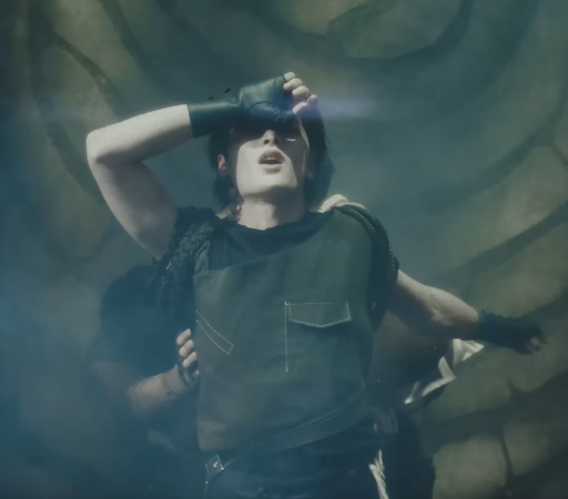 I.N on his back being held up by people underneath him. He has one hand obscuring his eyes and the other dangles below him. He's so fucking fine I cannot bear it.