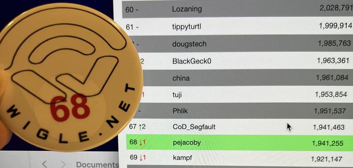A white button with the Wigle.net logo is in front of a screenshot of the Wigle stats board. The button matches the position #68 of Pejacoby
