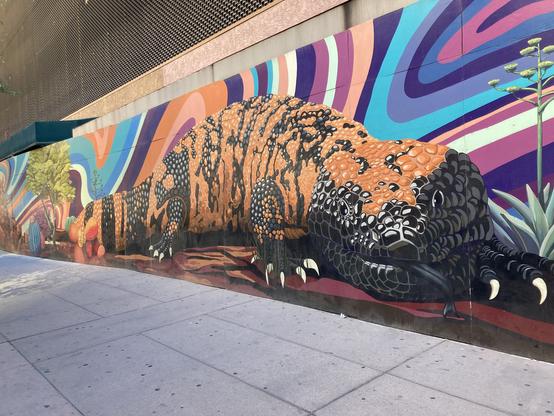 portion of a mural featuring a gila monster lizard. the scales are very detailed.