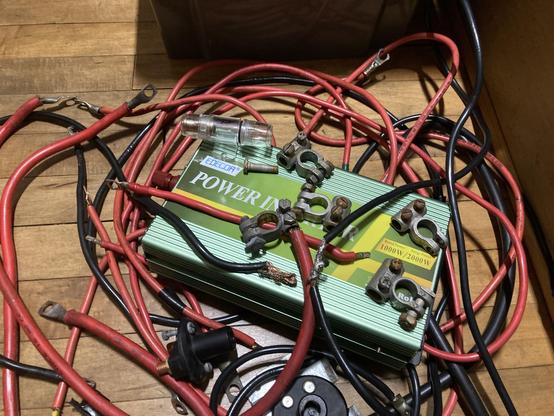 pile of shitty old 12v electric cables and a terrible inverter, removed from a narrowboat engine bay