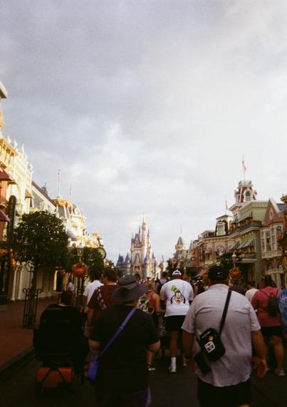 Crowds making their way up Main Street USA toward Cinderella's Castle.