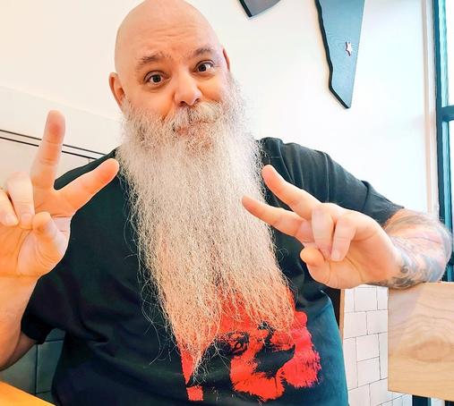 Me, a big-bearded bald Santa\Biker-looking dude in a black t-shirt making 2 "peace" signs
