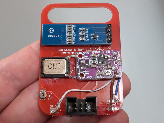 The back side of the Speak & Spell SAO showing several components connected by small jumper wires (badly)