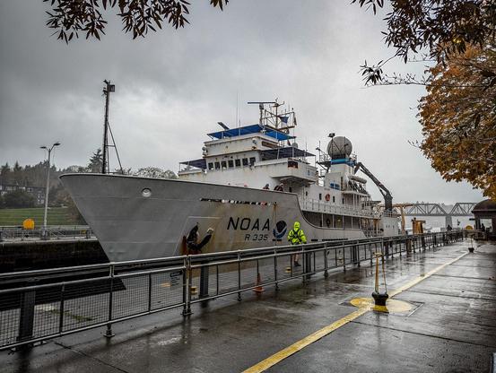 NOAA research ship enters the large locks at the Ballard Locks.