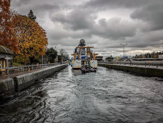 NOAA research ship exits the large locks at the Ballard Locks.