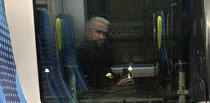 A ghostly reflection of me in the train window.