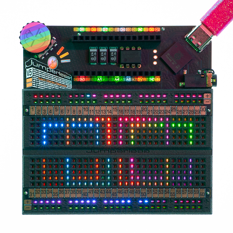 A Jumperless V5 (revision 2, the power supply bit top center looks different now) with a rainbow full color resin clickwheel cap