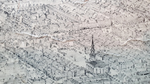An oblique bird's-eye view showing St Enoch Square and its immediate surroundings. To the north lie broad streets of respectable buildings; to the east the buildings are crammed together with the streets almost lost between them.