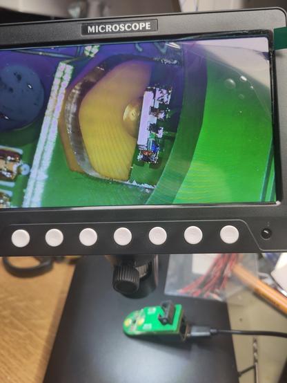 RGB LED close up on a screen, the PCB is blurred in the background.