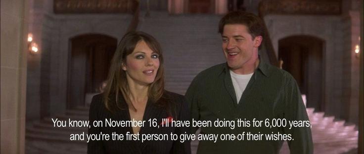 A man and woman walk side by side out of a courtroom. The woman is saying, "You know, on November 16, I'll have been doing this for 6,000 years, and you're the first person to give away one of their wishes," and the man is grinning