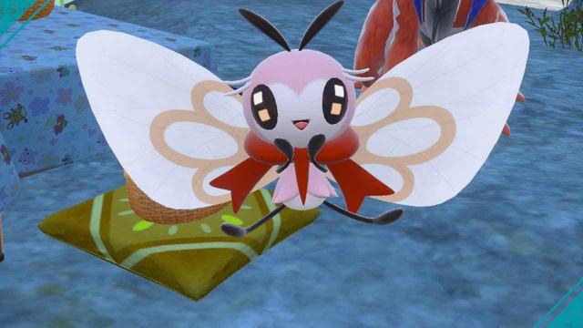 A screenshot of a shiny Ribombee in a cute, happy pose.