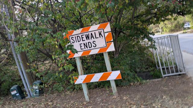 Sign on sidewalk: Sidewalk Ends