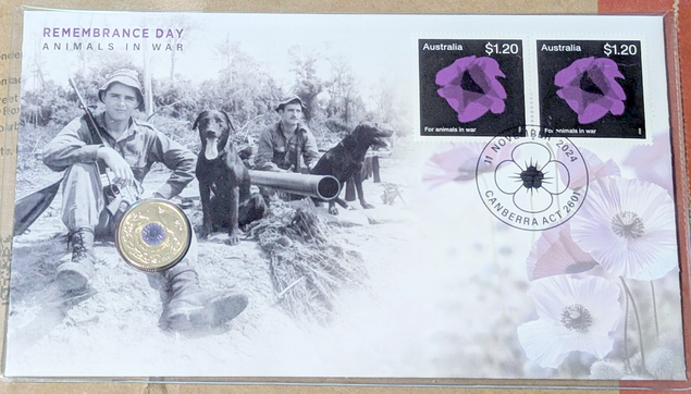 PNC with "Remembrance Day, Animals in war" on the top left, two purple poppy $1.20 stamps top right and an image of purple poppies on the right, with two soldiers and horses on the left, with the coin on the left