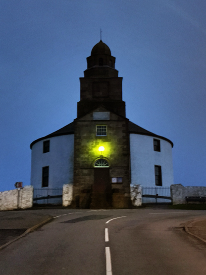 Round church on a hill with a star in the middle of its tower