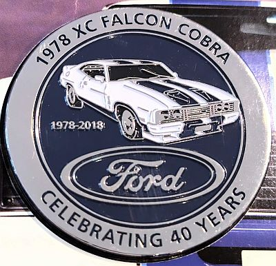 Medallion front with "1978 XC Falcon Cobra" above and "Celebrating 40 years" below. front three-quarter view of car with 1978 - 2018 above blue Ford oval logo