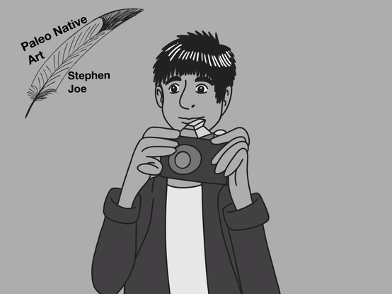 A teenage navajo boy is holding a camera while he’s trying to take pictures.