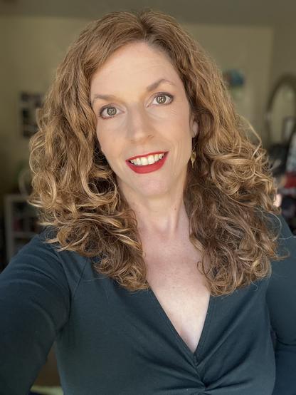 Jendia Gammon in a dark green v-neck shirt