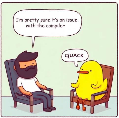 A cartoon shows a bearded man sitting in a chair saying, "I'm pretty sure it's an issue with the compiler," while a yellow duck sitting across from him responds with "QUACK."