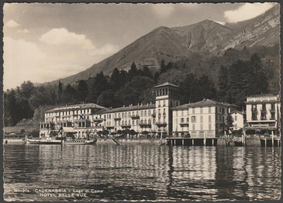 Monochrome real photographic postcard showing a view of the Hotel Belle Vue at Cadenabbia on Lake Como in Lombardy, Italy.
Published by Brunner & C, Como, No 111. 50a.
Postally used on 23 June 1949 with Cadenabbia cancellation on red 25l espresso stamp and sent to Mr A. Needs MFS, DCL Research Station [Distillers Company Ltd], 8 Elton Road, Clevedon, Somerset, England.
Poor condition, with slight corner bumps, but multiple creases to corners and centre of the card.