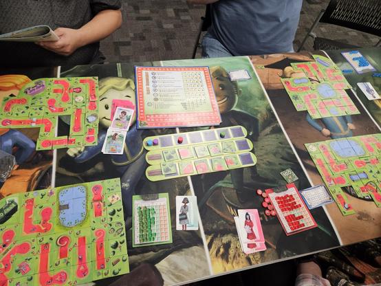 A wide shot of minigolf designer. Four different minigolf courses on the four corners of the table.