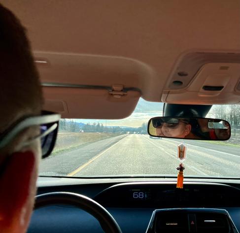 Chad with the over glasses from backseat looking through windshield driving on I5