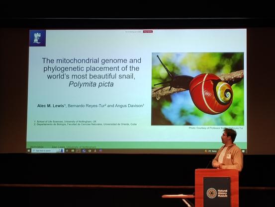 Alec showing first slide of presentation "The mitochondrial genome and phylogenetic placement of the world's most beautiful snail Polymita picta"
