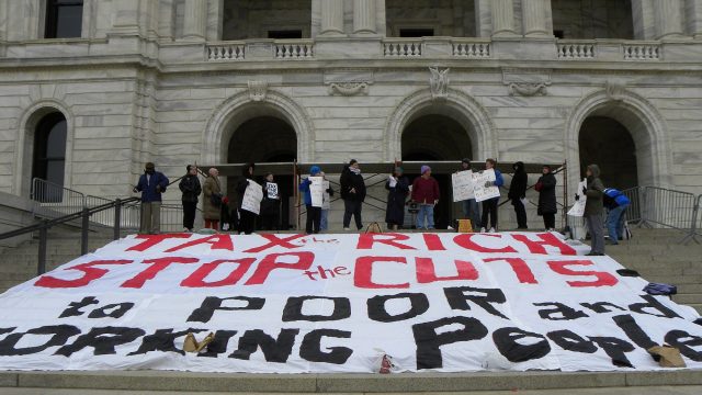 Protest to tax the rich stop cuts in social programs. Fibonacci Blue from Minnesota, USA
