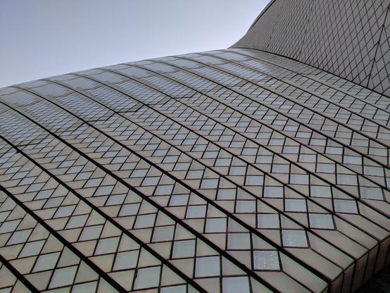 Image displays a close-up view of the ceramic tiles cladding the Sydney Opera House.