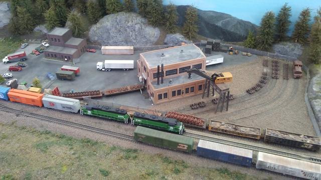 Lots of train action, with 3 tracks full of trains - including a Burlington Northern freight train in the middle track.