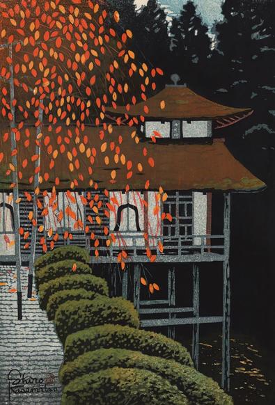 The leaves of a cherry tree in autumn yellow and orange screen our view of part of Kyoto's Joshokoji Temple. The branches of the tree are supported from below by poles, in anticipation of snow; beneath the tree, cloud-pruned shrubs line up along a walkway toward the temple building. Beyond, the silhouettes of trees crowd out all but a small glimpse of a dim sky