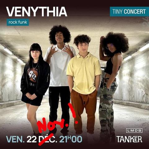 Affiche du concert avec les 4 membres du groupe.