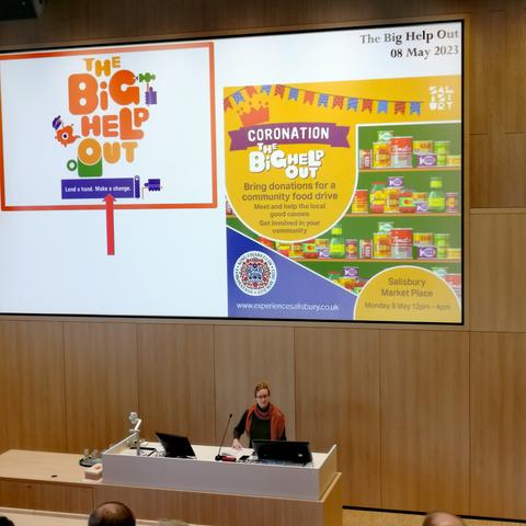 Julia Boll in front of her presentation