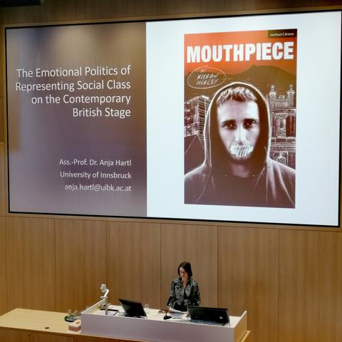 Anja Hartl in front of her presentation