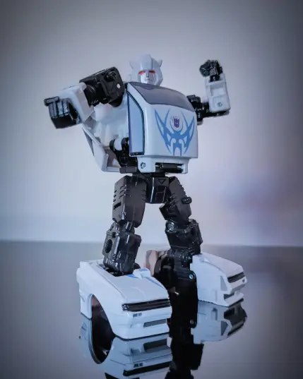 Bug Bite in his white and black (with purple "tribal" stickers added) version of Transformer Bumblebee. This is his most recent Generations release.