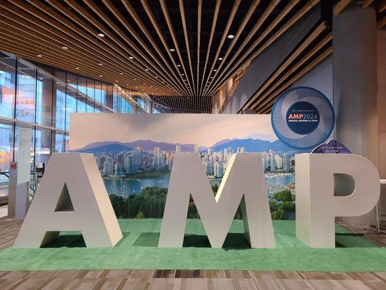 A big installation of AMP letters inside the convention center