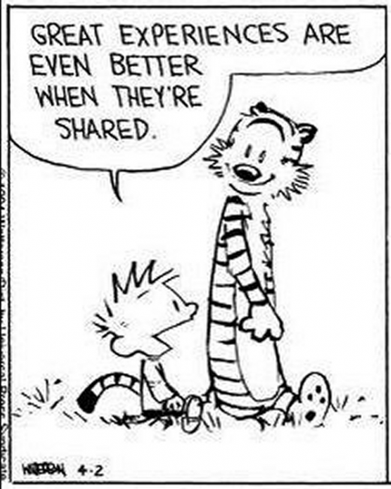 Calvin and Hobbes are gently strolling along in the grass - Hobbes is smiling broadly - Calvin says “great experiences are even better when they're shared”