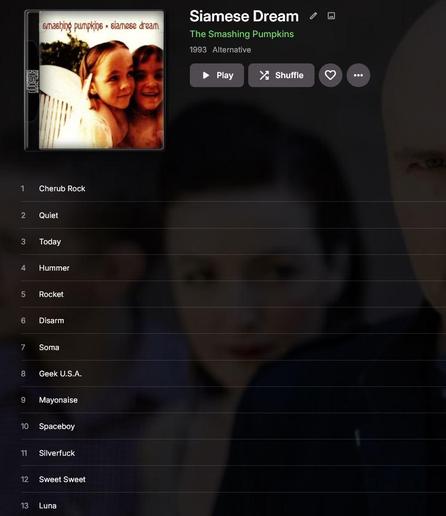 The album cover and track listing for the album Siamese Dream by the Smashing pumpkins on a dark partially transparent background with