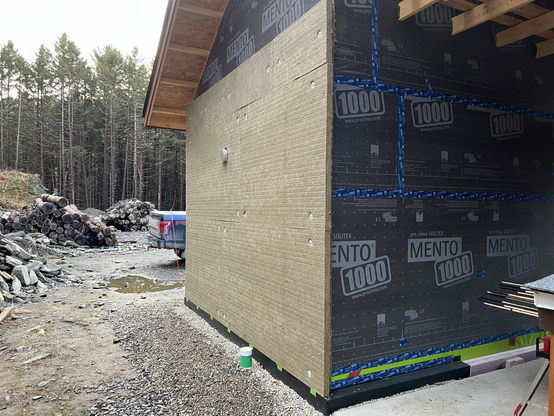 4” of Rockwool Comfortboard 80 insulation installed on a wall.