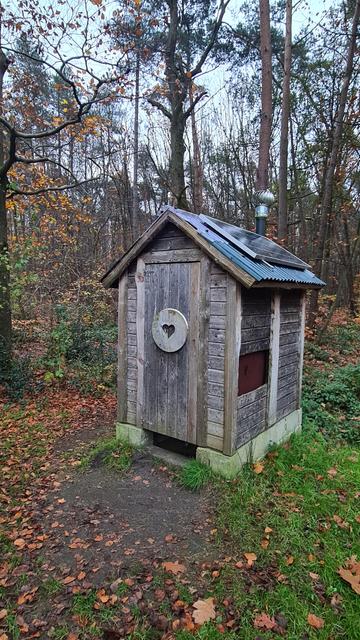 A solar freakin' toilet. It's an outhouse in nature and the door has heart on it.