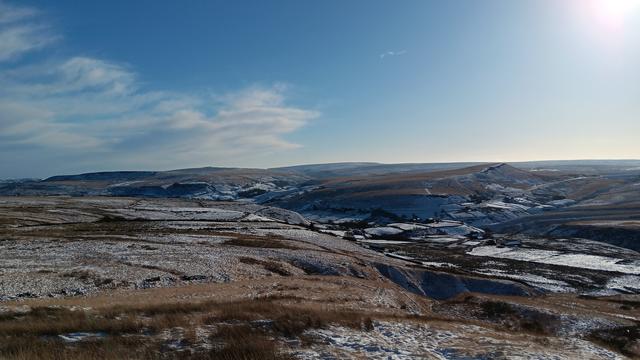 Snow covered landscape at Marsden Moor, looking east towards Pule Hill.