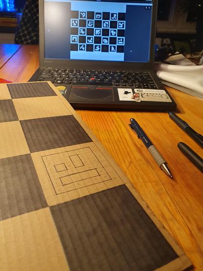 A chessboard liking cardboard 7x5 where the white squares in turn are 8x8 squares with different patterns.