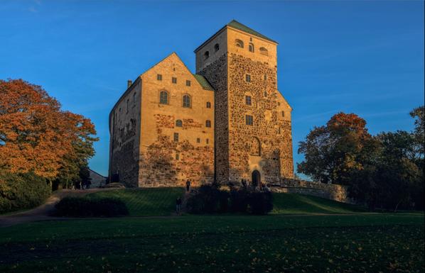 Turku castle basking in the light of the setting sun.