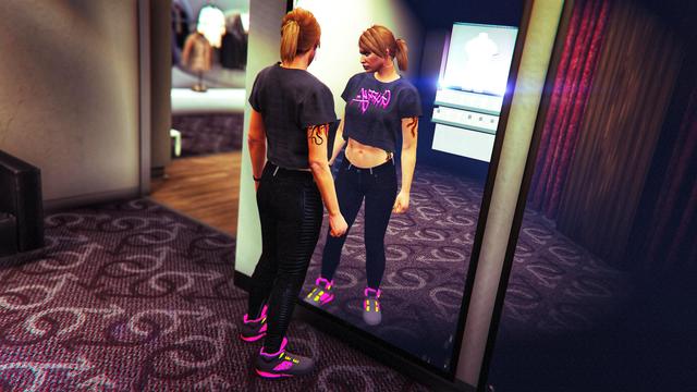 A screenshot I took in the video game GTA Online using the Rockstar Editor. It shows my female character checking out her new outfit in the mirror at a clothing store.