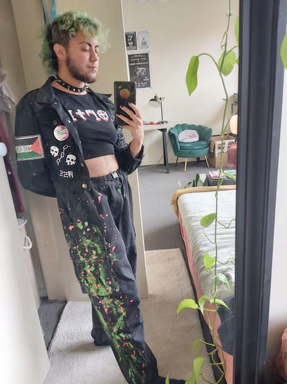 me wearing the pants. i am also in my battle jacket, which i've strategically tucked behind my selfie arm to make my tits look bigger