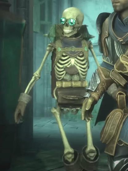 NPC Manfred in the game Dragon Age Veilguard: A friendly skeleton with glowing green goggles, a backpack, gauntlets, and a hard leather front fanny pack, standing in a dungeon